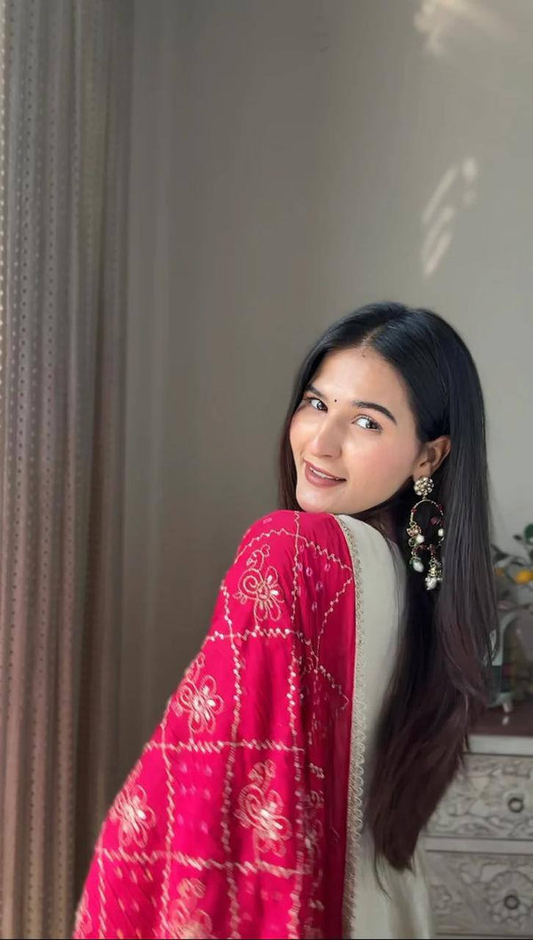 Add elegance to your festive look with this Exclusive 3 Piece Gown Pair crafted in luxurious Chinon fabric. Adorned with golden lace and fine piping