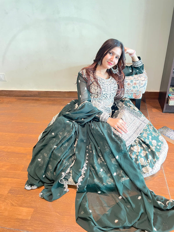  "Elegant Faux Blooming gown with Zari Jacquard embroidery, pan neck, and full sleeves."















