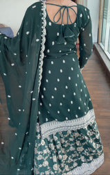  "Back view of Faux Blooming gown showcasing intricate Zari Jacquard embroidery and elegant design."

