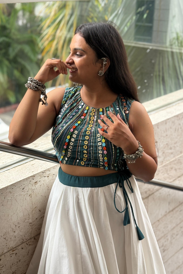 Paired with a soft, breezy white flared skirt