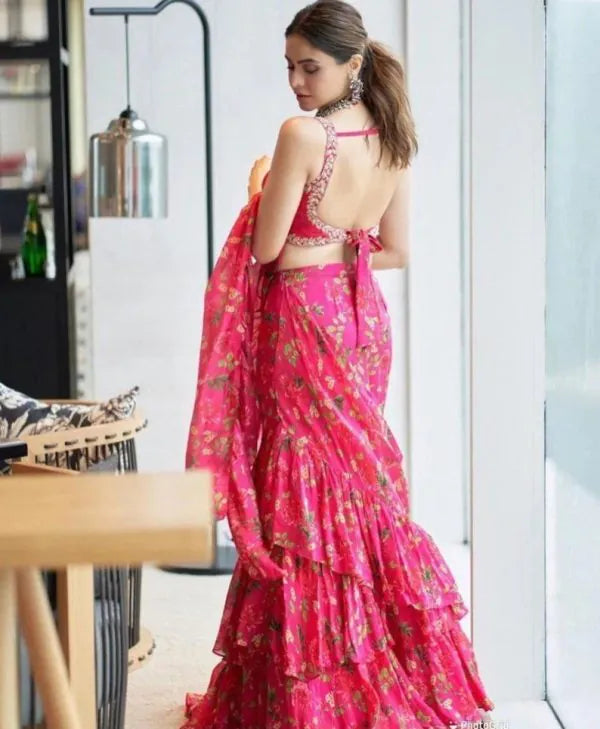 Crafted from premium Faux Georgette, this saree features digital print work, 2-layer ruffle detailing